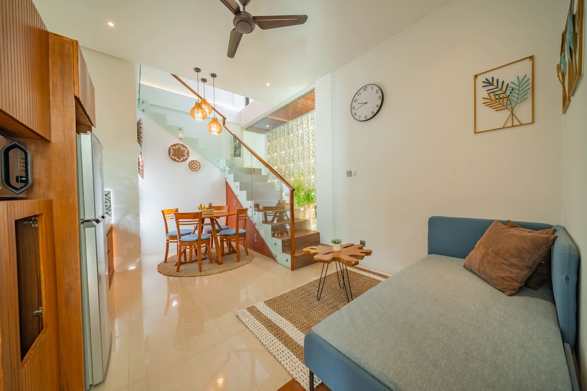 Airy open living area flowing seamlessly from the lounge to the dining space