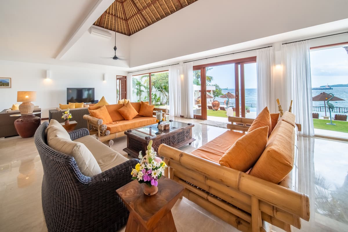 The main lounge, looking out to the pool and the sea