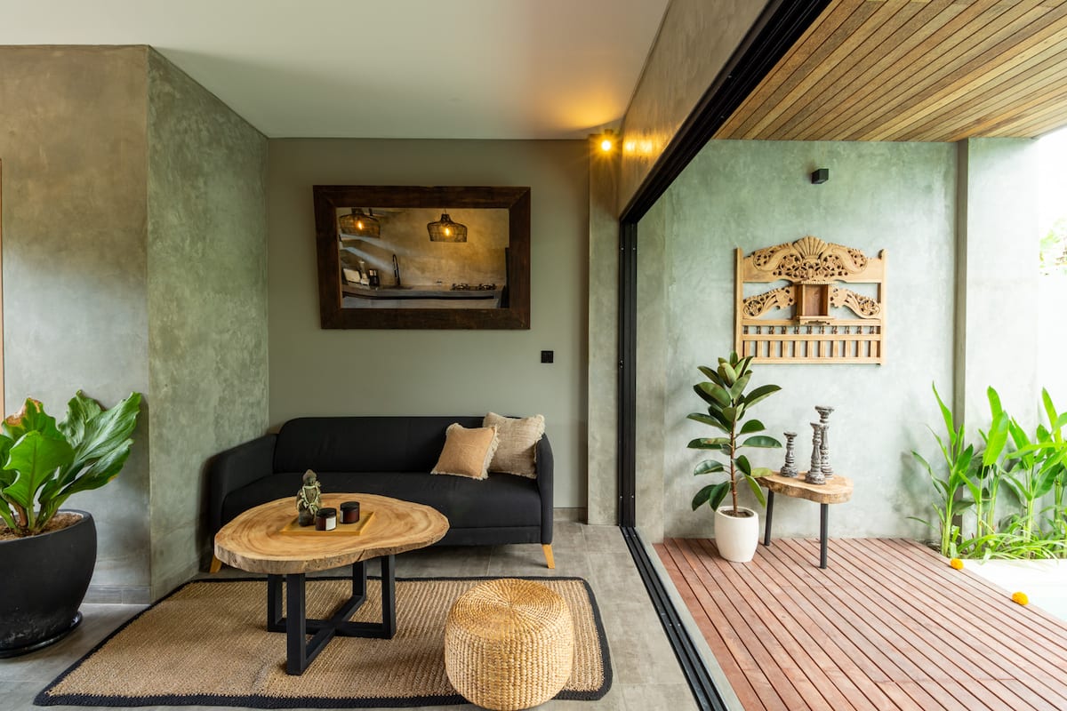 This cozy en-closed/open lounge space in our Canggu Airbnb is the perfect spot for a lazy day on your vacation trip